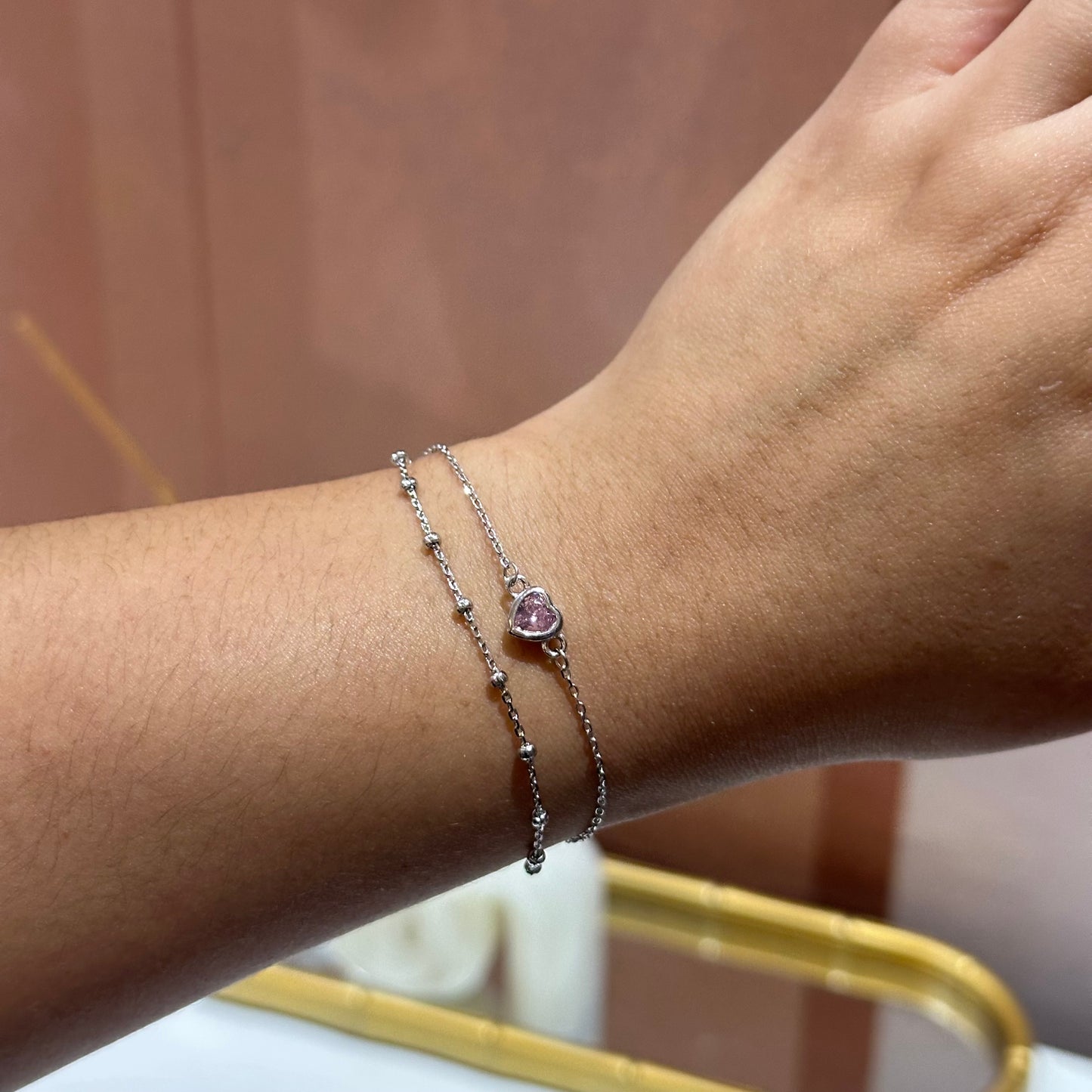 Pulsera doble corazón rosa