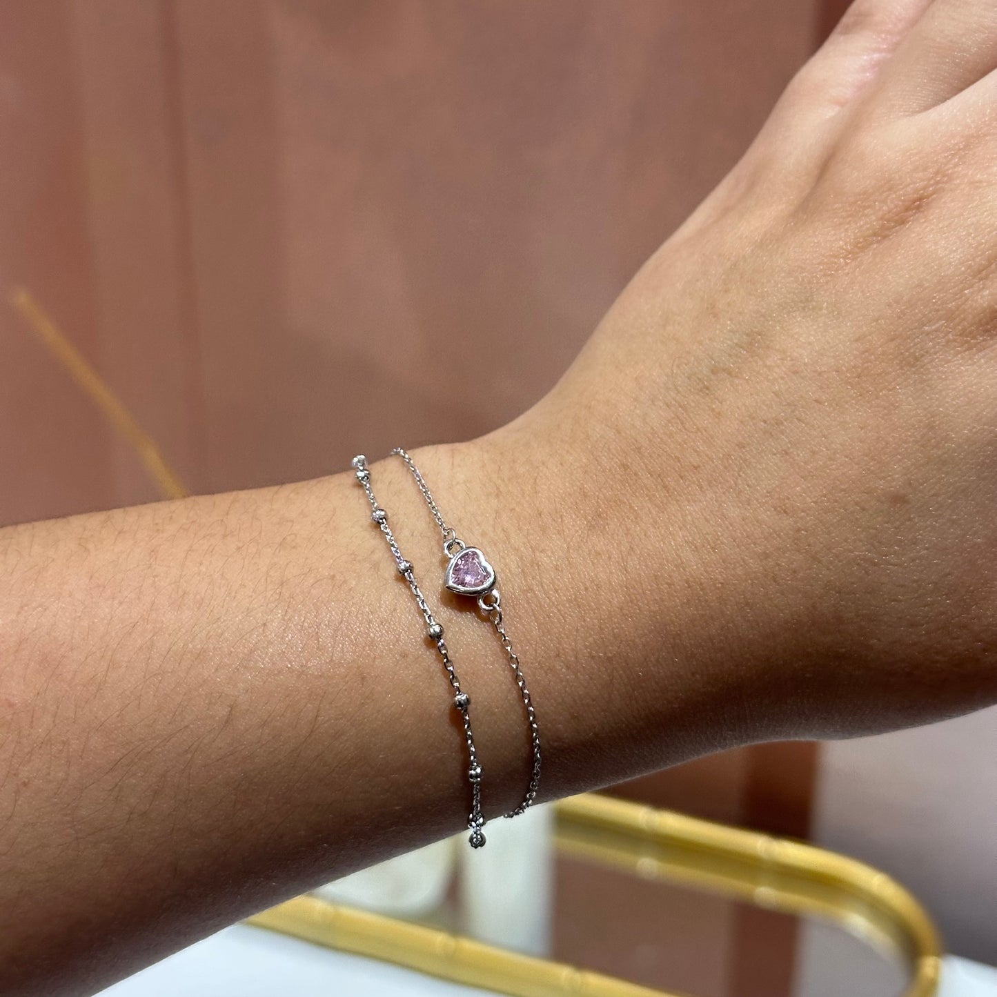 Pulsera doble corazón rosa