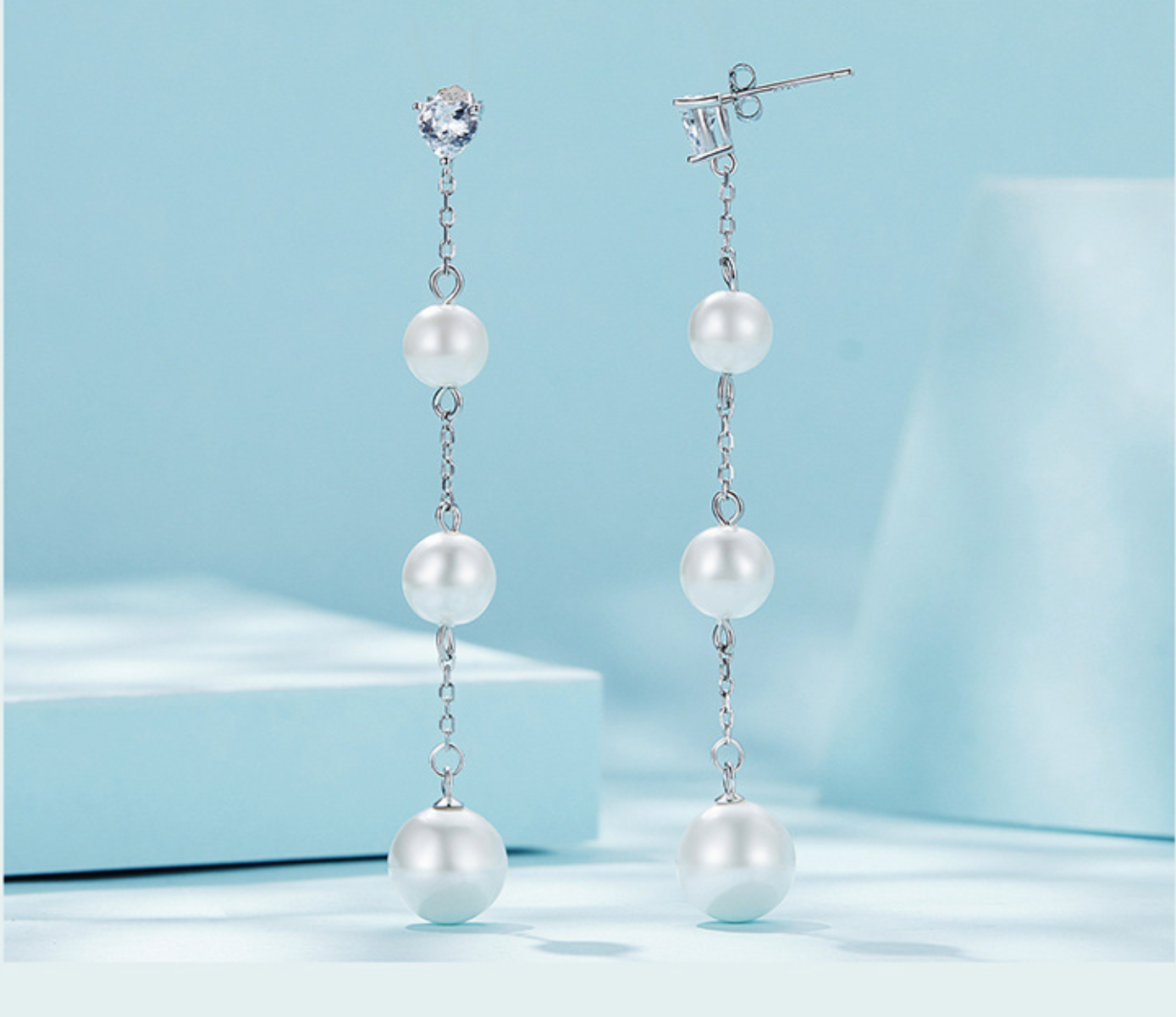 Aretes una zirconias 3 perlas colgantes