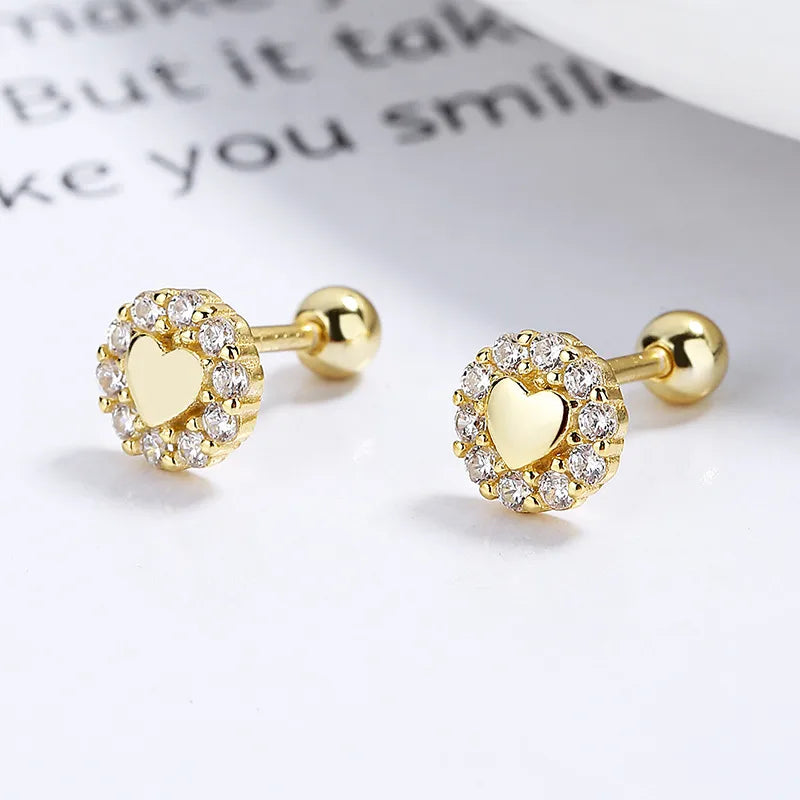 Piercing de plata corazón con borde de zirconia dorado 💛